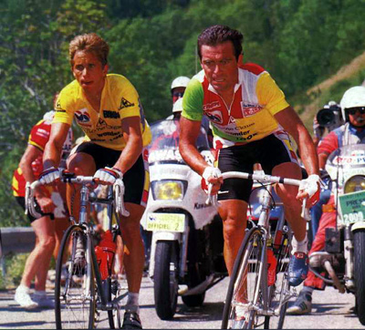 Bernard Hinault in the combination jersey climbing beside Greg LeMond in yellow at the 1986 Tour